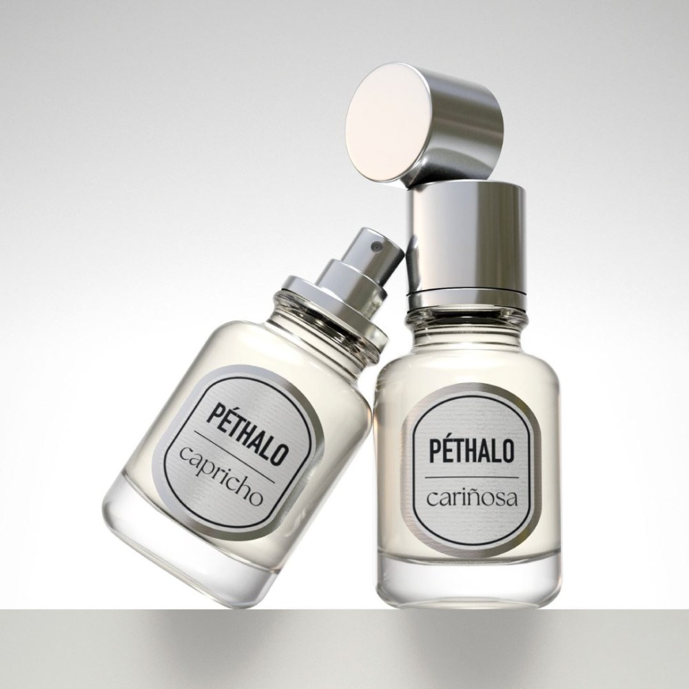 Image of Cariñosa and Capricho Extrait de Parfum bottles taken from a low camera angle.